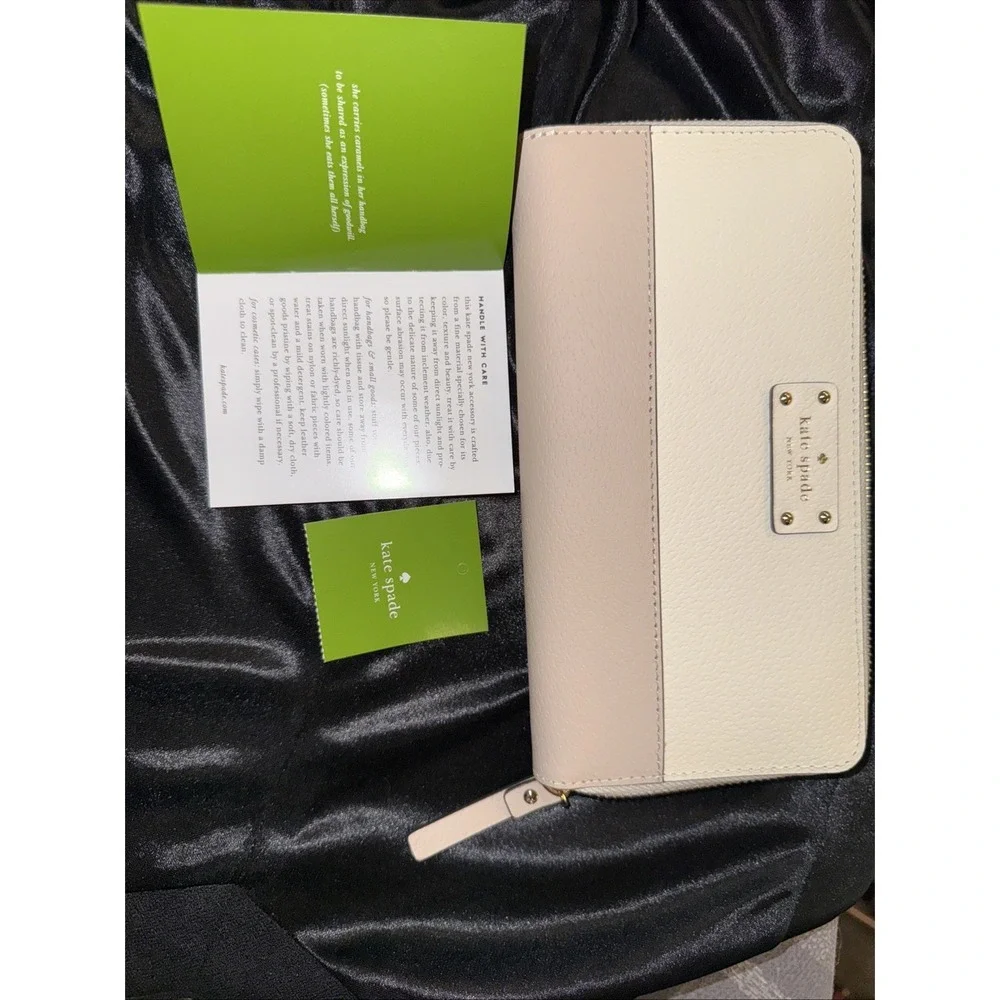KATE SPADE large zip around white and tan wallet brand new